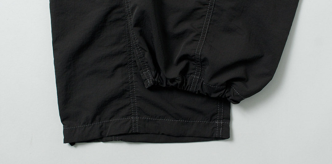 AND WANDER / Crinkle Nylon Pants